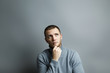 © alexxndr - Man thoughtfully put his hand to his chin