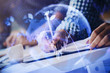 © peshkova - Multi exposure of two men planing investment with stock market forex chart.