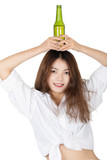 Fototapeta Panele - Chinese woman holding bottle of beer isolated on white background
