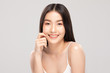 © 220 Selfmade studio - Beautiful Asian woman touching soft cheek smile with clean and fresh skin Happiness and cheerful with positive emotional,isolated on white background,Beauty and Cosmetics Concept