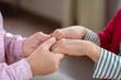 © zinkevych - Close up picture of mans hands holding womans hands