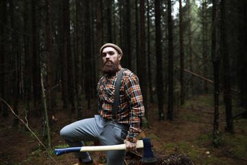 Wall Mural - A bearded lumberjack with a large ax