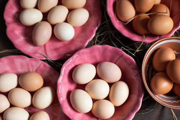 Wall Mural -  Preparing for Easter. Chicken eggs on plates are prepared for coloring. Flat lay