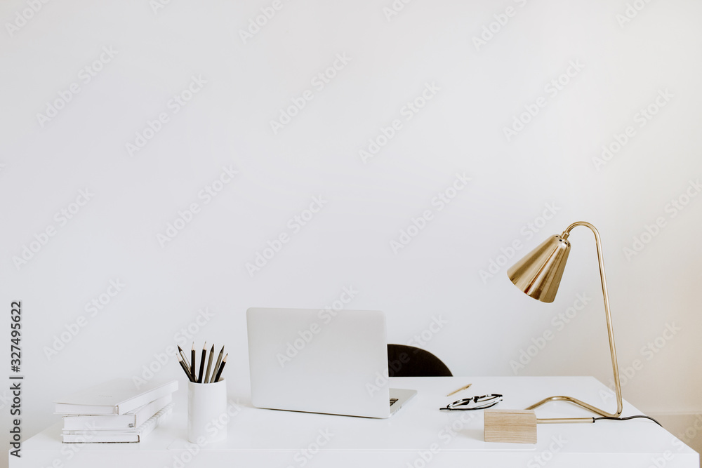 Office with laptop, lamp, notebooks. White working study cabinet. Outsourcing freelancer, blogger, boss workspace. - obrazy, fototapety, plakaty 