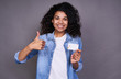 © Svitlana - Attractive young african woman with her credit card.