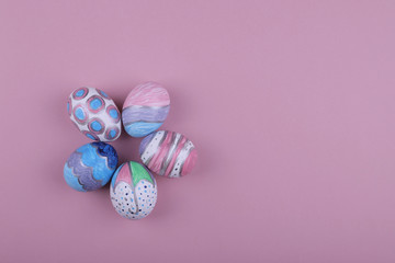 Wall Mural - painted handmade easter eggs on a pink background