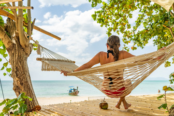 Poster - Woman relaxing at the beach