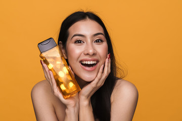 Poster - Beauty portrait of young brunette half-naked woman holding shower gel