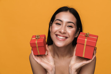 Wall Mural - Beauty portrait of half-naked woman smiling while holding present boxes