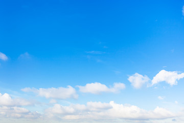 Wall Mural - chain of little cumuli clouds in blue sky