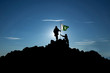 Two soldiers raise the Pakistani flag