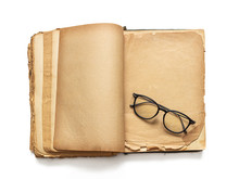 An Open Old Book And Glasses, On Yellowed Pages