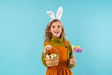 Poster - Photo of joyful blonde girl ears holding basket and colorful eggs