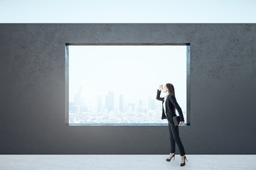 Canvas Print - Businesswoman standing in empty interior