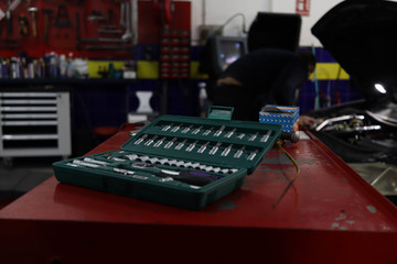 Toolbox. Set of ratchet wrenches and screwdriver heads in car workshop