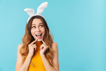 Portrait Of Young Woman Wearing Toy Bunny Ears Smiling And Having Fun