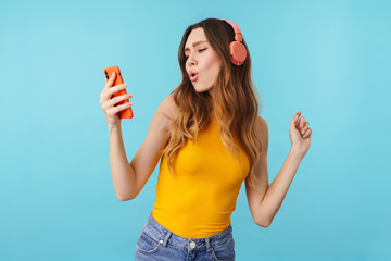 Poster - Portrait of beautiful woman wearing headphones listening to music