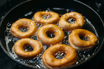 Donuts in a pan. Preparing donuts at home..