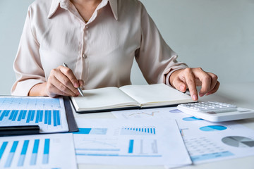 Wall Mural - business woman accountant financier working audit and calculating expense financial annual report ba
