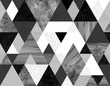 Seamless geometric abstract pattern with black, spotted and gray watercolor triangles on white background