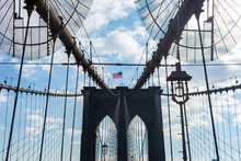 Arches On The Brooklyn Bridge With An American Flag In New York City