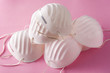 © chandlervid85 - Medical face mask on pink background