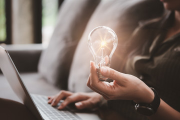 Aufkleber - women holding light bulbs, ideas of new ideas with innovative technology and creativity.