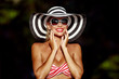 Beautiful woman in hat and sunglasses. Outdoor summer fashion portrait