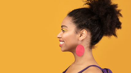 Wall Mural - Profile of happy black woman looking at free space