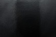 © Michal - Black background made of real, shiny black paper covered with foil, illuminated by a soft light from above.