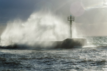  HURRICANE BY THE SEA - Storm waves crashing on the breakwater in the port