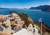 Fototapeta Na drzwi - View of the city of Oia and the ruins of an ancient Venetian fortress. Santorini, Greece