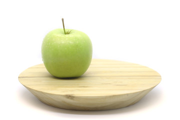 Green apples on a plate isolated on a white background.