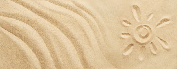 Tropical sand background with sand waves and sun. Sandy beach texture with copy space. Top view