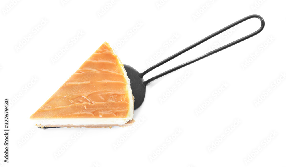 Slice of sweet caramel cheesecake on white background