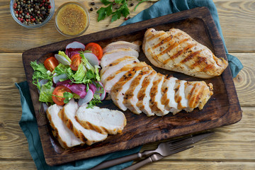 Wall Mural - grilled chicken fillet with vegetable salad