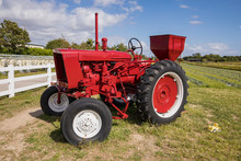 Old Red Tractor In A Field
