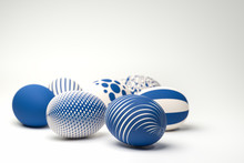 Easter Eggs With Different Textures In Classic Blue On A Seamless White Background. Selective Focus On Foreground.