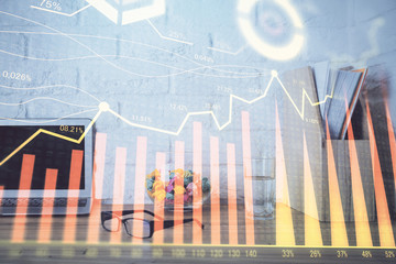 Financial market graph hologram and personal computer on background. Double exposure. Concept of forex.