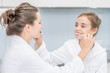 © Ermolaev Alexandr - Mom and daughter brush each other's teeth