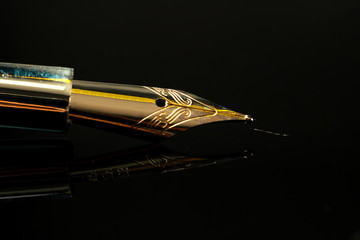 Close up of a pen on black background