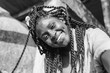 © olezzo - Happy young beautiful african american woman with pigtails and a piercing on her face makes selfie, beautiful smilling happiness and joy