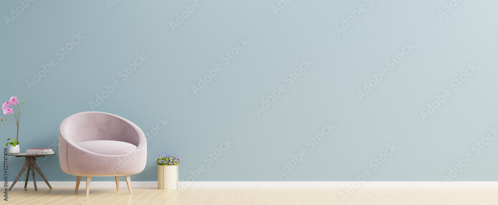 The interior has a pink armchair on empty blue wall background. - obrazy, fototapety, plakaty 