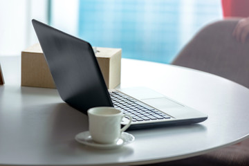 Laptop with a cup of coffee on the desk