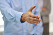 © Syda Productions - business people, cooperation, partnership and deal concept - close up of businessman making handshake gesture at office