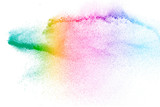 Fototapeta Tęcza - Colorful background of pastel powder explosion.Multi colored dust splash on white background.Painted Holi.