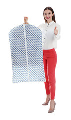 Sticker - Young woman holding hanger with clothes in garment cover on white background. Dry-cleaning service