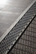 Street table tennis or ping pong net and stone table. Monochrome grey background.Different shades of gray.Outside summer activity, sports game unusual conceptual shot. Diagonal, macro shot, copy space