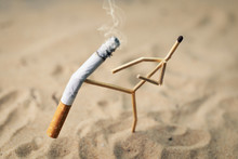 Stop Smoking Concept - Match Man Kick Off A Burning Cigarette