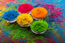 Holi Color Powder. Organic Gulal Colours In Bowl For Holi Festival, Hindu Tradition Festive. Bright Vibrant Pigment Closeup